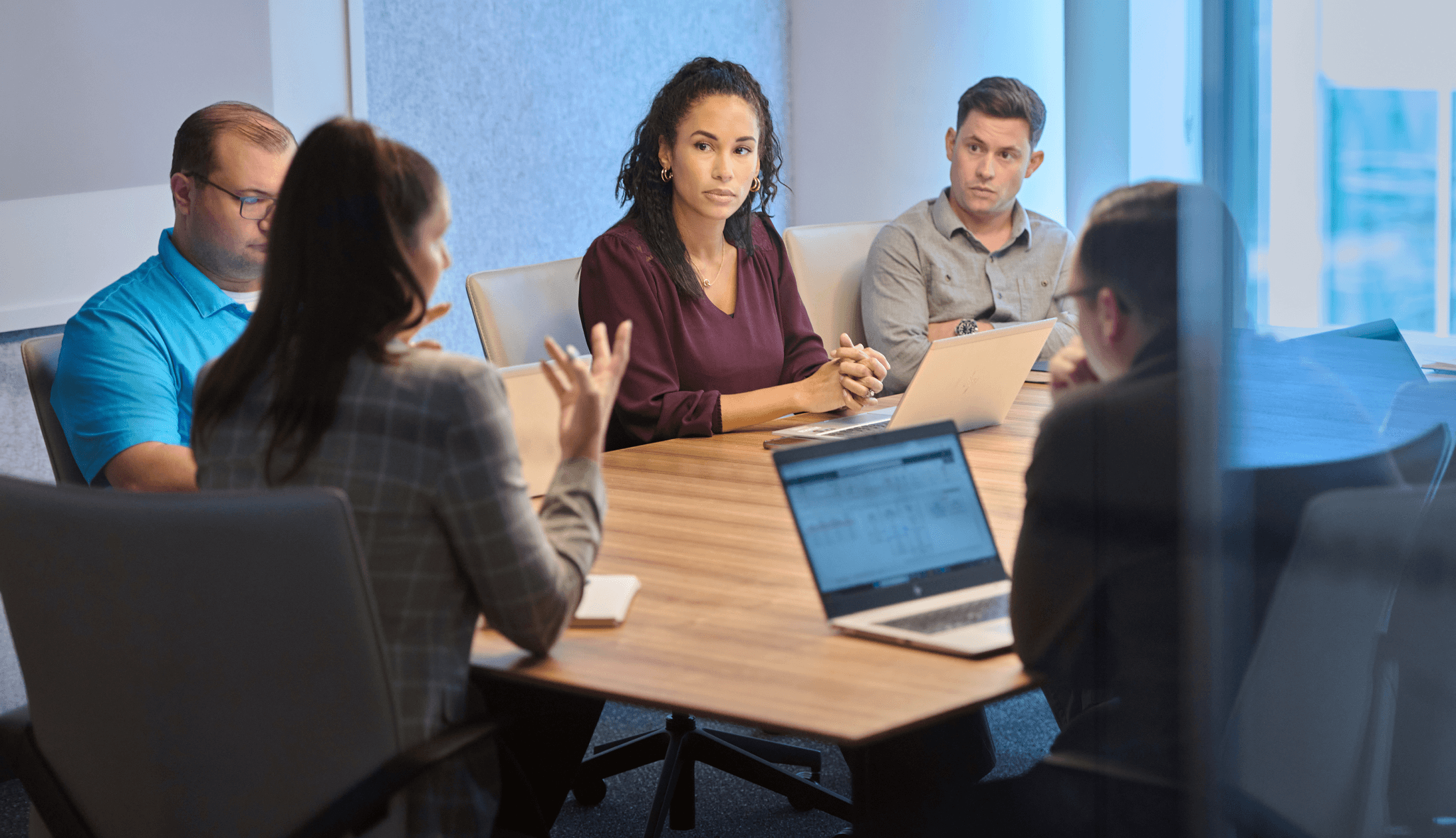 Sales team discussing a project in a meeting room 